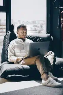 Man on laptop looks like he is working remotely.
